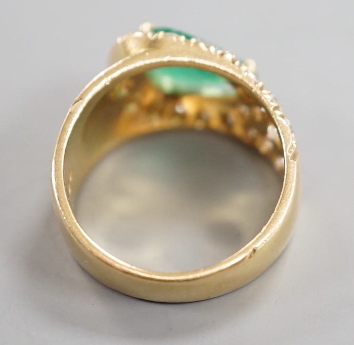 A modern yellow metal, pear cut emerald and diamond cluster set dress ring, size H, gross weight 5.1 grams.